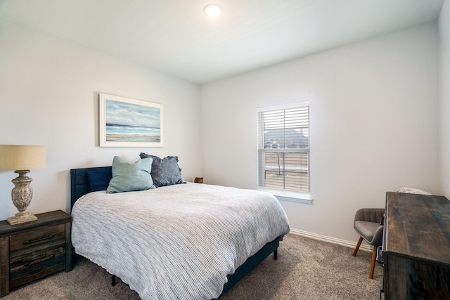 carpeted bedroom with baseboards