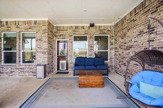 doorway to property with an outdoor hangout area and a patio