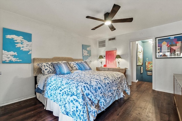 bedroom with wood-type flooring, visible vents, ceiling fan, and baseboards