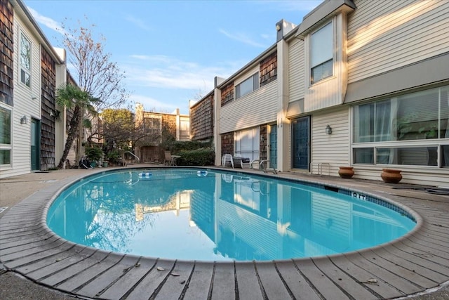 view of swimming pool with a fenced in pool