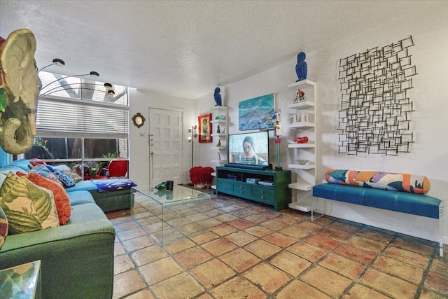 living area with a textured ceiling