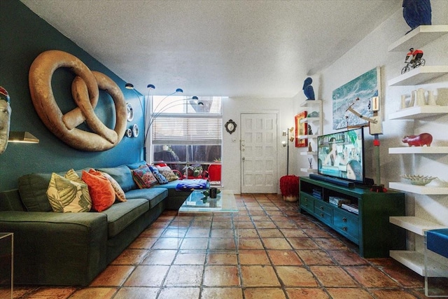 living area with a textured ceiling