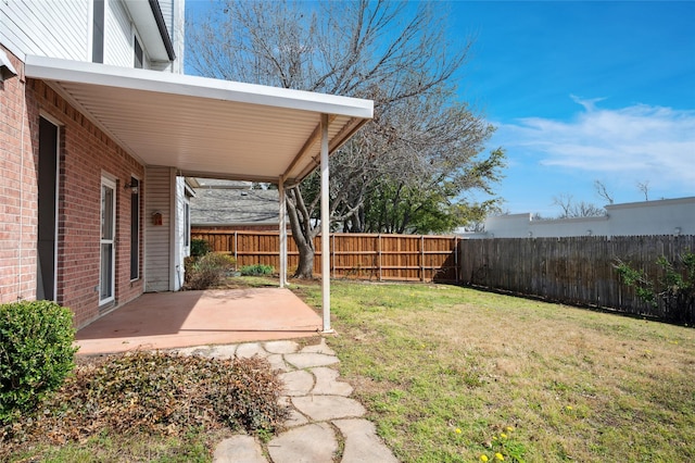 view of yard with a patio area and fence