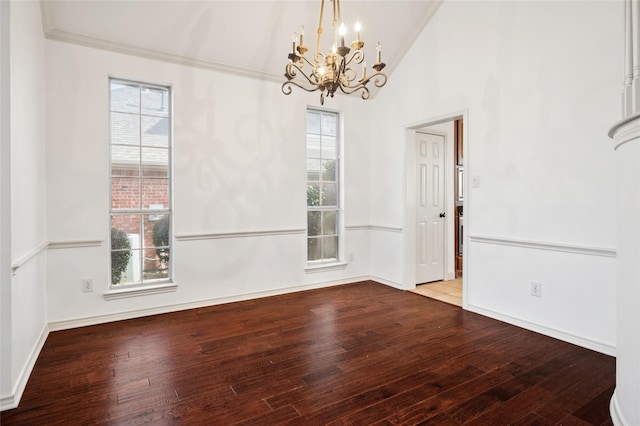 unfurnished dining area featuring plenty of natural light, baseboards, vaulted ceiling, and hardwood / wood-style floors