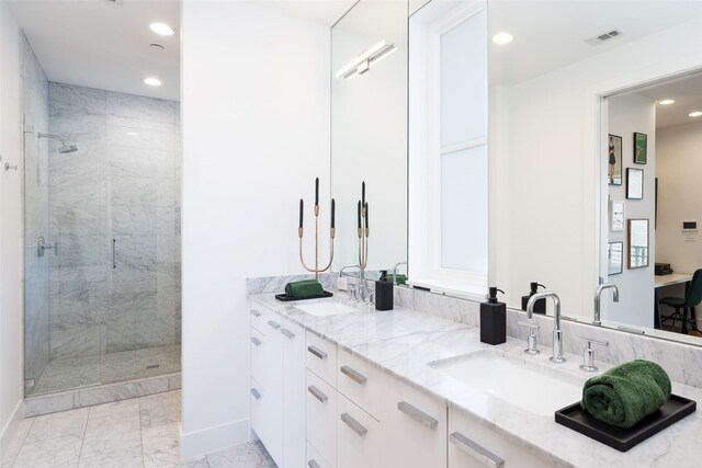 bathroom featuring a sink, marble finish floor, recessed lighting, and a shower stall