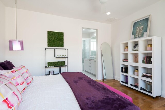 living area featuring washer / clothes dryer, wood finished floors, recessed lighting, and plenty of natural light