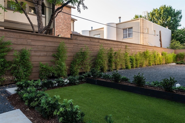 view of yard with a fenced backyard