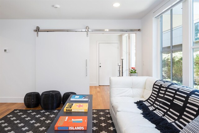 bedroom with visible vents, light wood-style flooring, baseboards, and ceiling fan