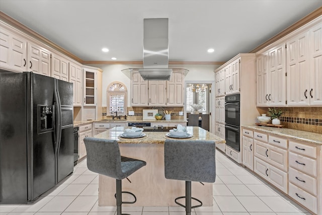 kitchen with light tile patterned floors, black appliances, a sink, and a center island