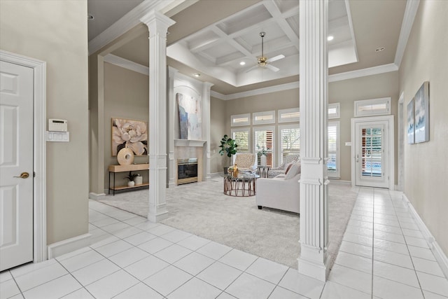 unfurnished living room featuring coffered ceiling, light carpet, a towering ceiling, and ornate columns