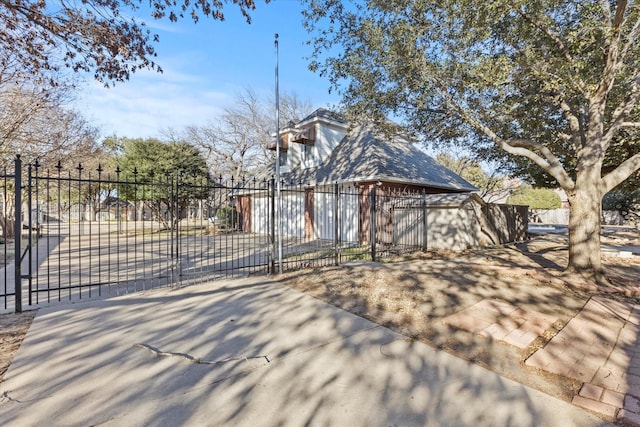 view of front facade with fence and a gate