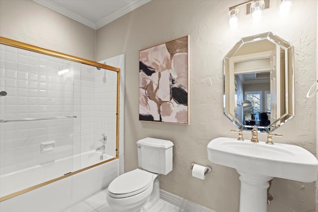 bathroom with toilet, crown molding, and a textured wall