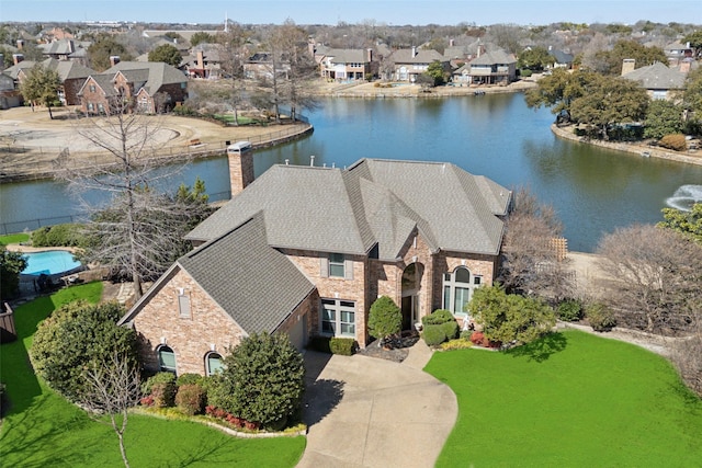 bird's eye view with a water view and a residential view