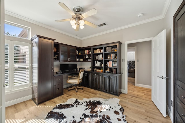 office area with crown molding, baseboards, visible vents, and light wood-style floors