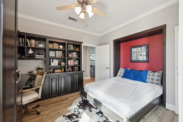 bedroom with light wood finished floors, baseboards, visible vents, and crown molding