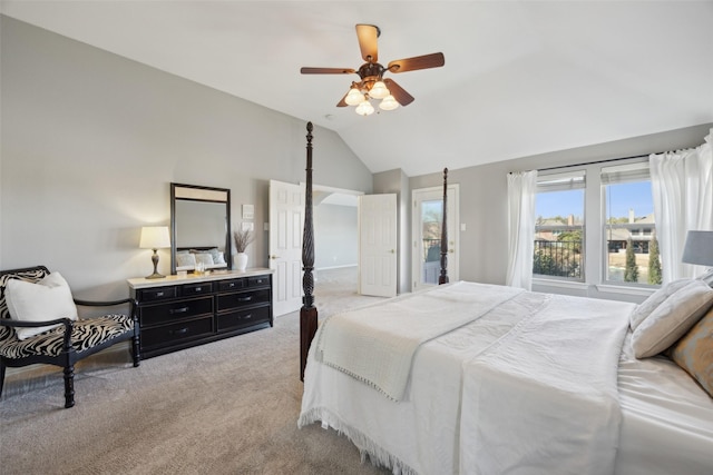 bedroom featuring lofted ceiling, a ceiling fan, and light colored carpet