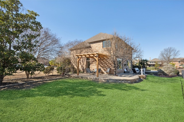 rear view of house featuring a yard, a patio, fence, and a pergola