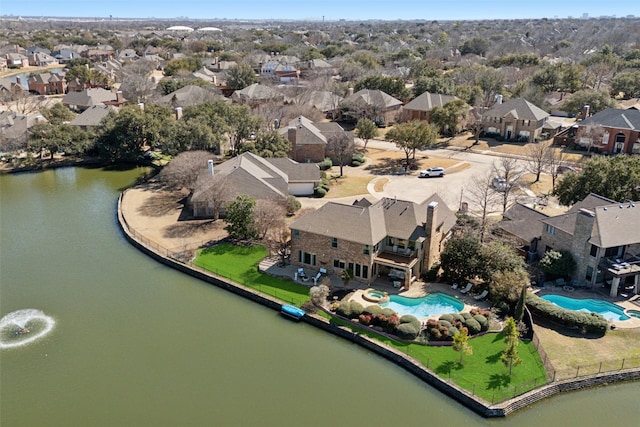 bird's eye view with a residential view and a water view