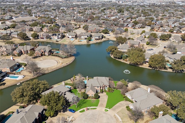 birds eye view of property featuring a water view and a residential view