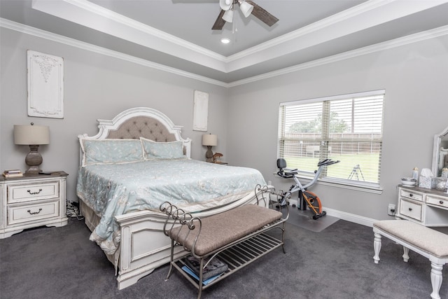 bedroom featuring carpet floors, a ceiling fan, baseboards, a tray ceiling, and crown molding