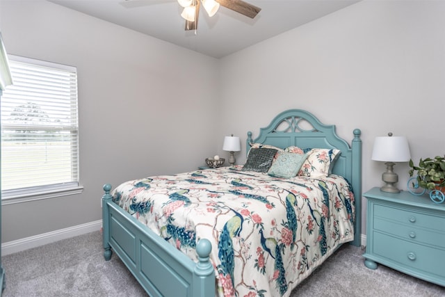 bedroom with baseboards, a ceiling fan, and light colored carpet