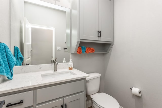 half bath with toilet and vanity