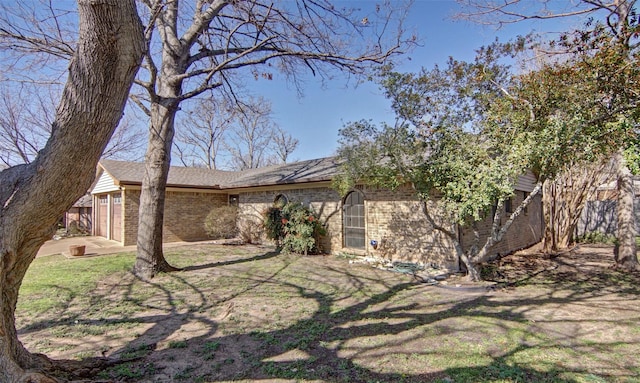 exterior space featuring brick siding