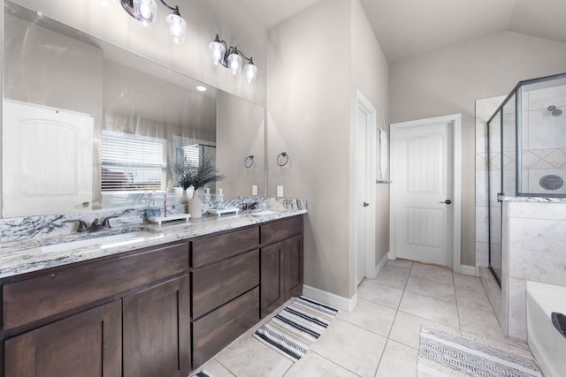 full bathroom featuring double vanity, a stall shower, a sink, and a bath