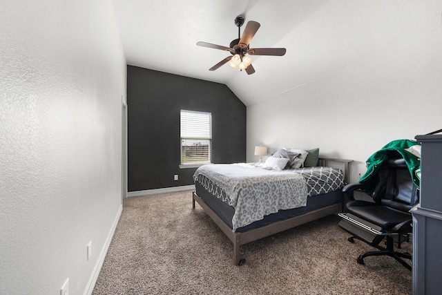 carpeted bedroom with a ceiling fan, vaulted ceiling, and baseboards