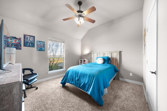 carpeted bedroom with lofted ceiling, ceiling fan, and baseboards