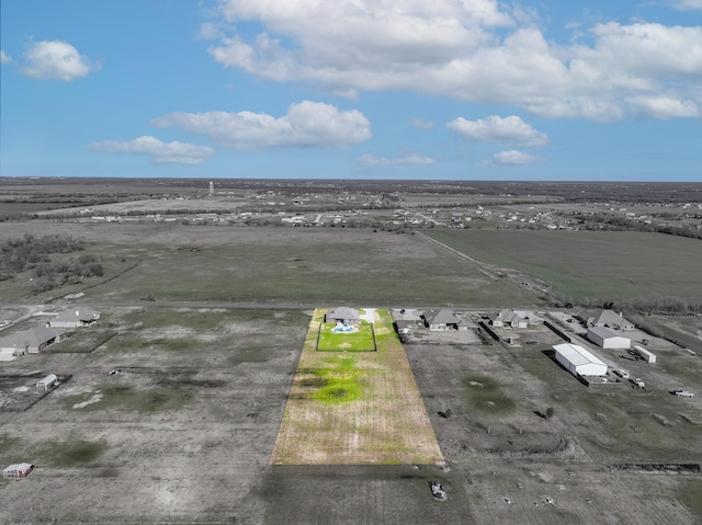 birds eye view of property with a rural view