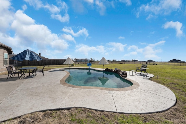 view of pool with a fenced backyard, a patio, and a yard