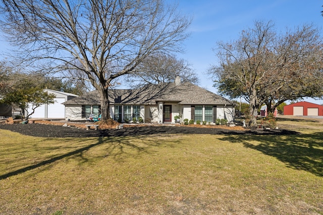 ranch-style house with a garage, a front lawn, and a chimney