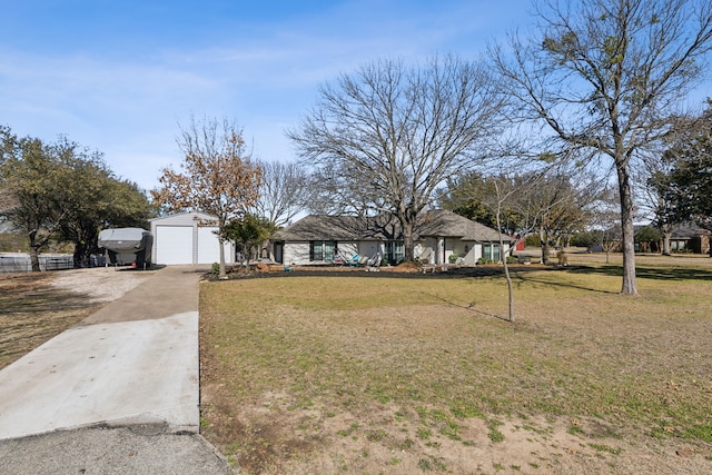 view of front facade with driveway and a front lawn