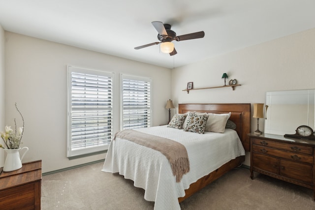 bedroom with ceiling fan and carpet floors