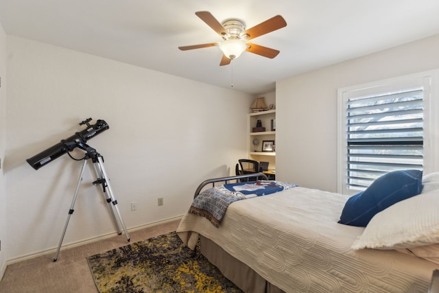 bedroom featuring a ceiling fan, carpet, and baseboards