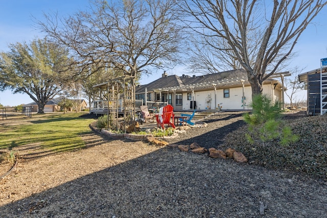 back of house with a patio, a pergola, and a yard