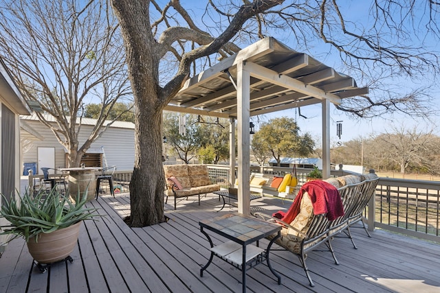 wooden terrace with outdoor dining space and an outdoor living space