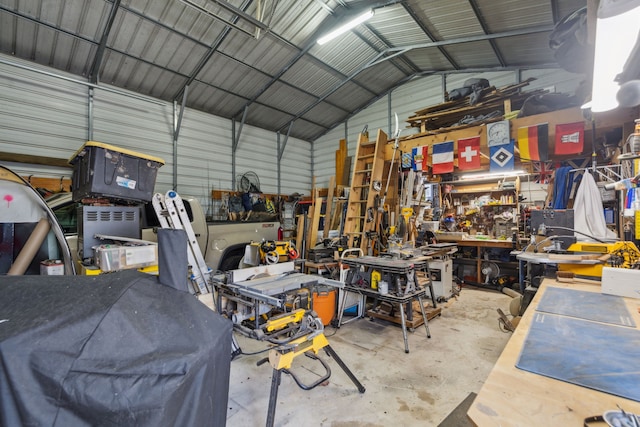 garage with metal wall and a workshop area