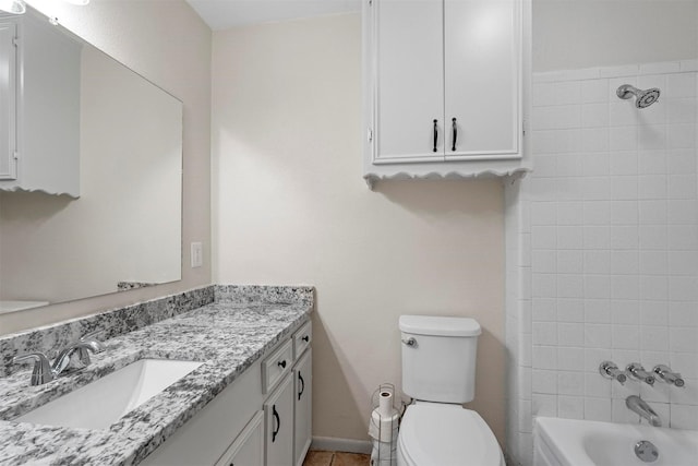 full bath with toilet, shower / tub combination, baseboards, and vanity