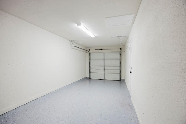 garage featuring baseboards