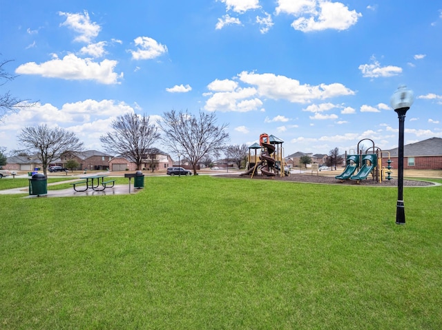 community jungle gym with a lawn