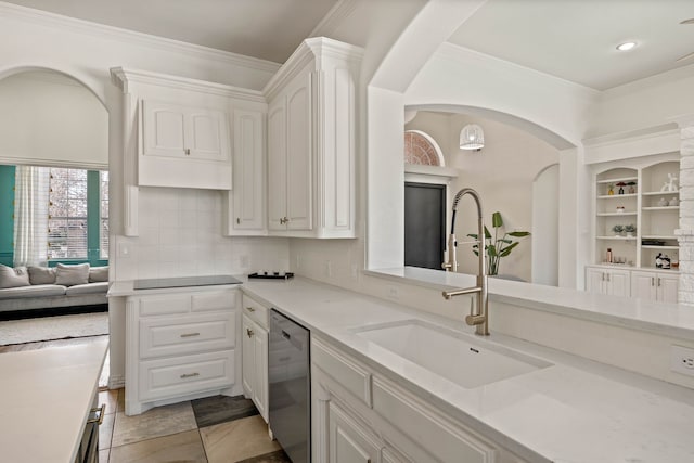 kitchen featuring a sink, crown molding, white cabinets, and stainless steel dishwasher