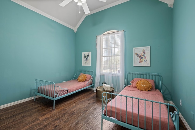 bedroom featuring vaulted ceiling, baseboards, wood finished floors, and crown molding