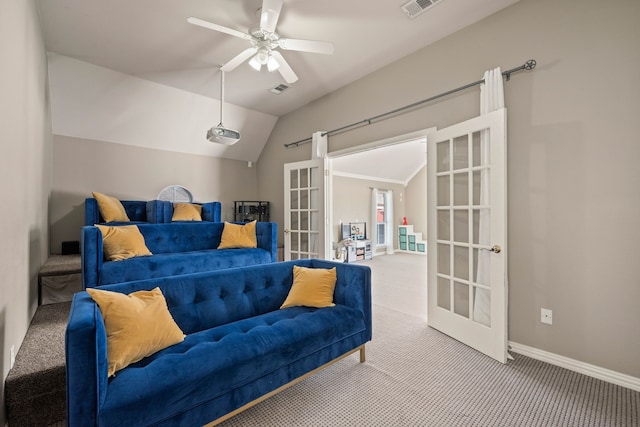 interior space featuring lofted ceiling, baseboards, visible vents, and french doors