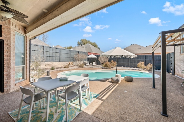 view of pool with a patio area, ceiling fan, and a fenced backyard