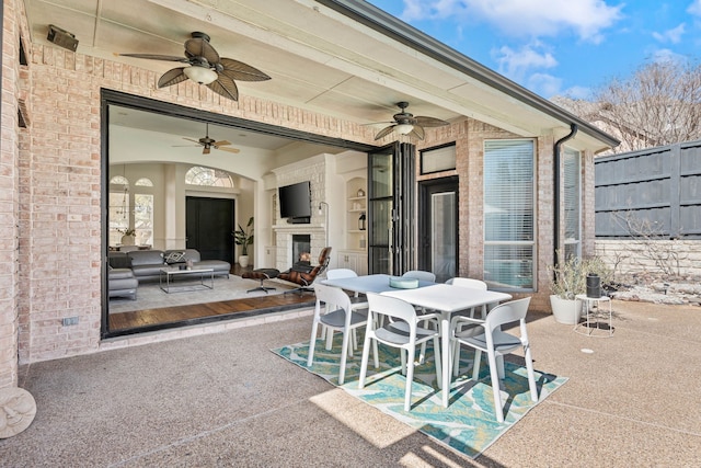 view of patio / terrace featuring ceiling fan and outdoor dining space