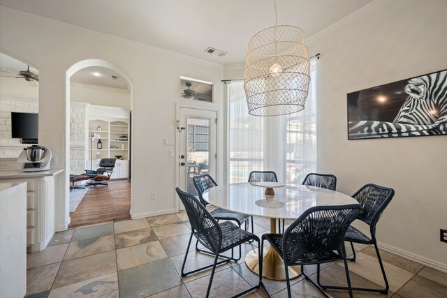 dining area with a notable chandelier, baseboards, and wood finished floors