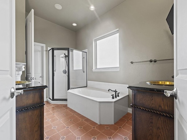 bathroom with recessed lighting, vanity, a shower stall, and a bath