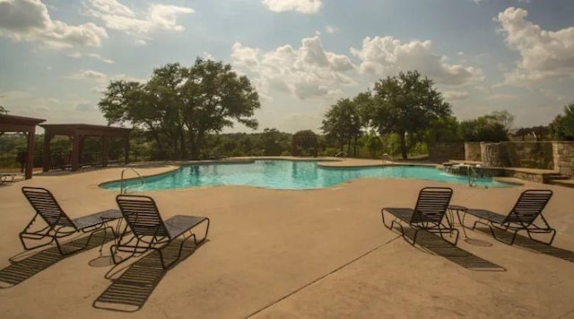 pool featuring a patio area